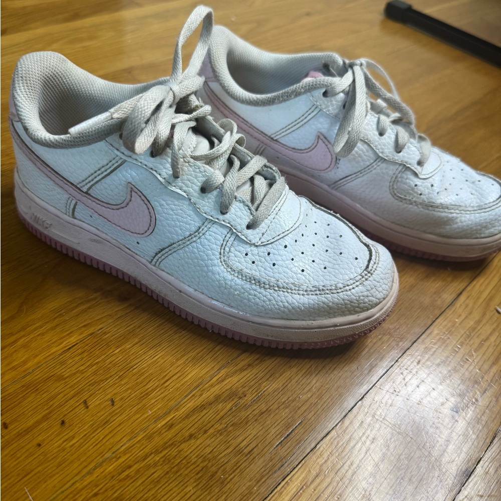 Girls white Nike Air Force Ones sneakers with a pink swoosh, size 2
